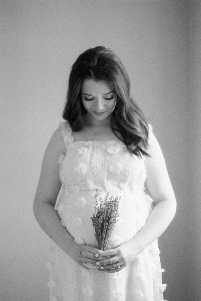 growing bump with dried lavender, captured on black and white film captured by Edmonton maternity photographer, Kahla Kristen Photography