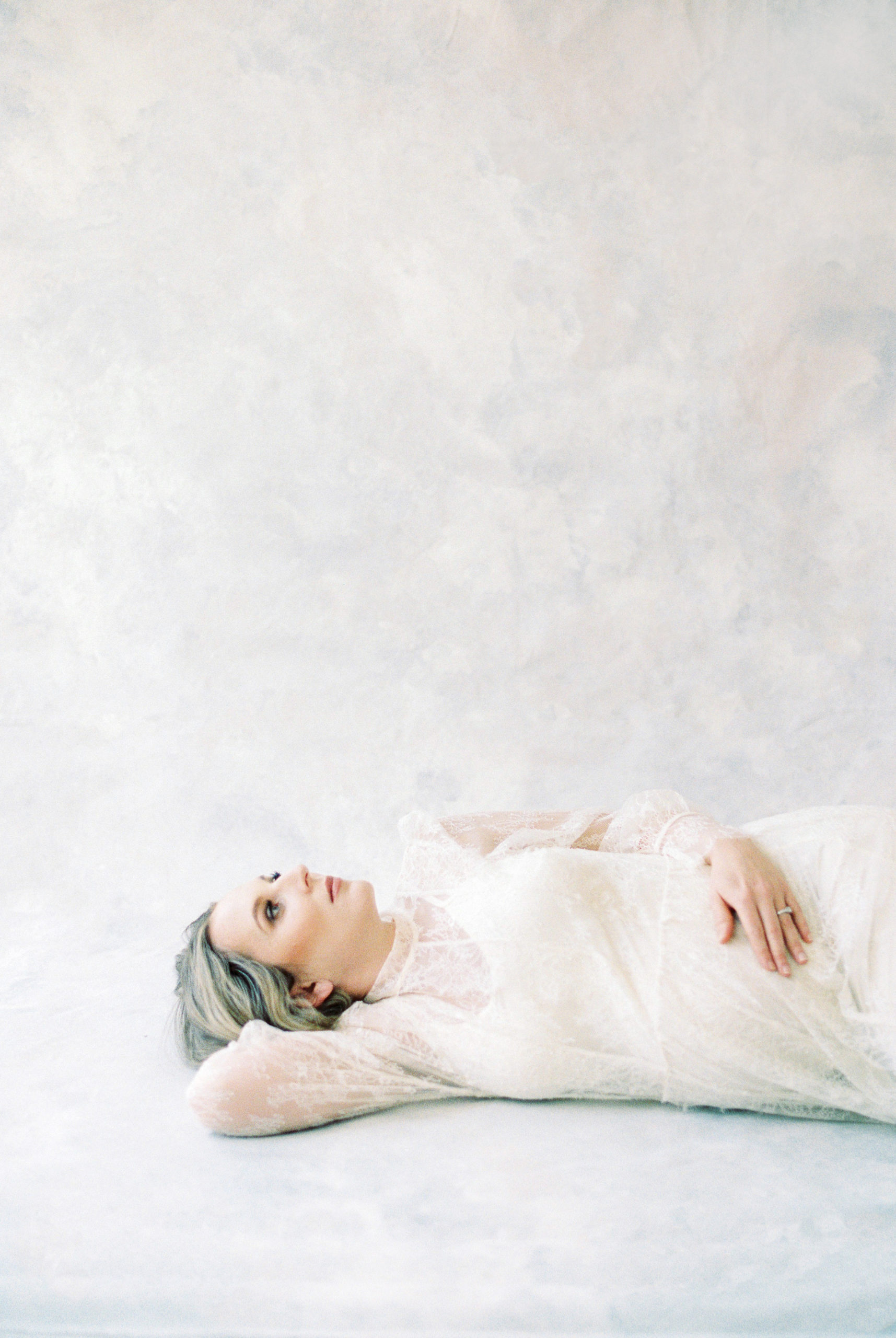 Film photo of expectant mother in white