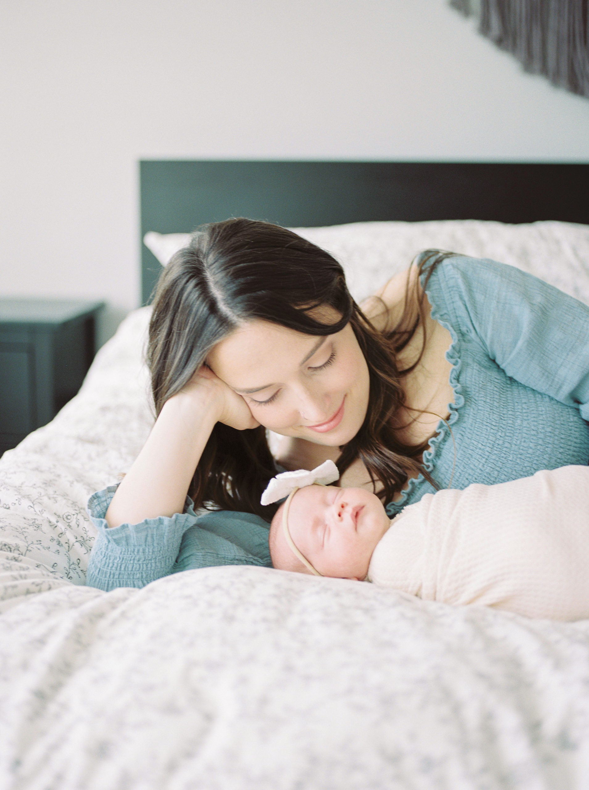 Natural light image of mom and newborn baby captured on film by Edmonton newborn photographer, Kahla Kristen Photography