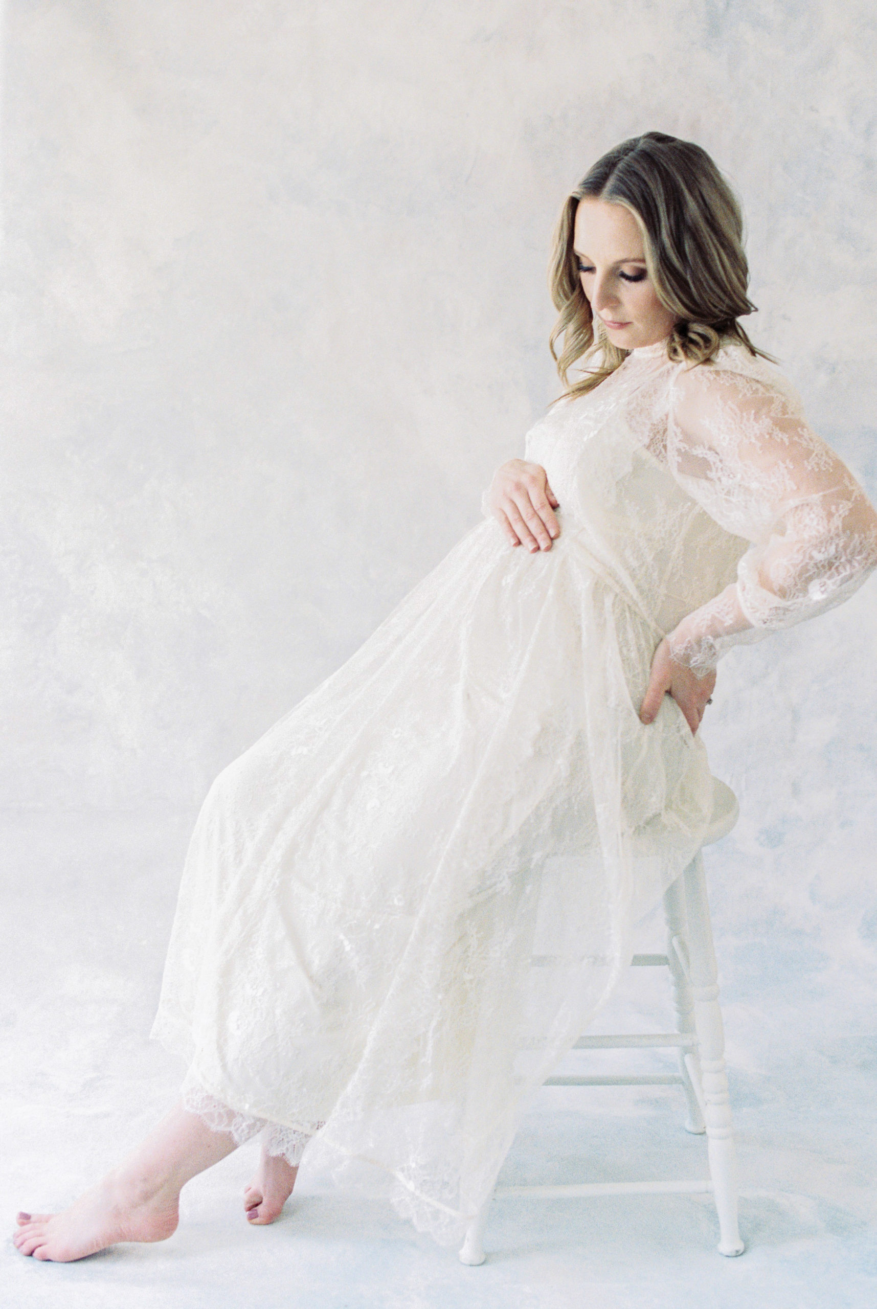 Film photo of expectant mother in white. Edmonton maternity photography