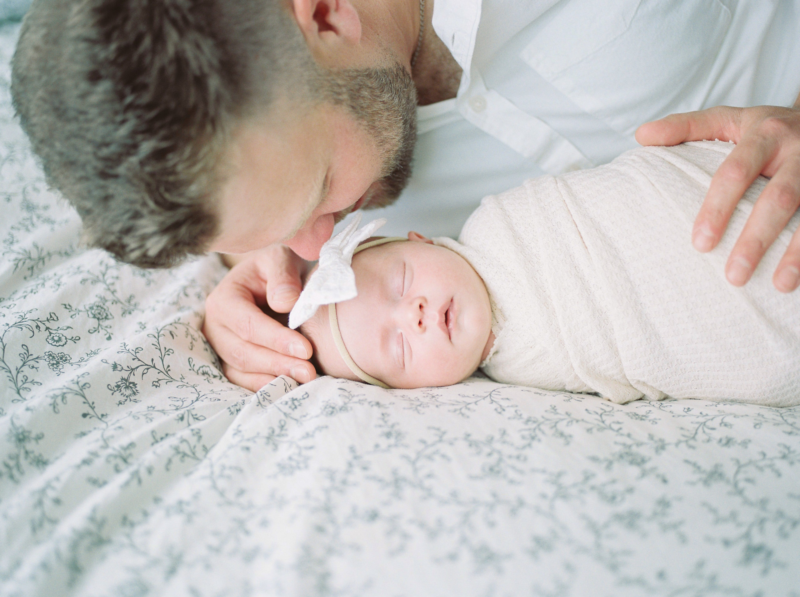 Natural light image of dad and newborn baby captured on film by Kahla Kristen Photography
