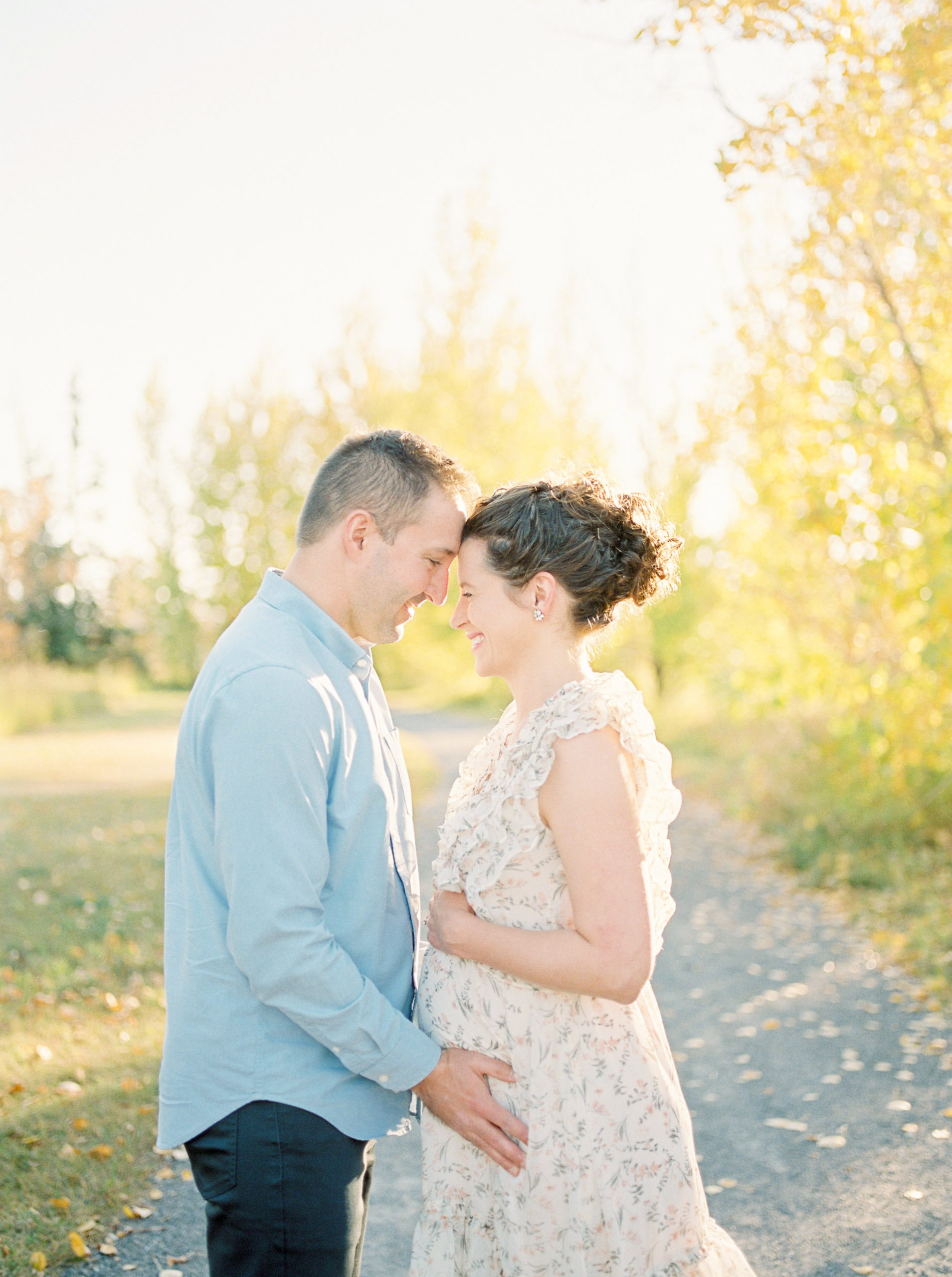 Edmonton Maternity Photographer capturing expectant parents in fall colours