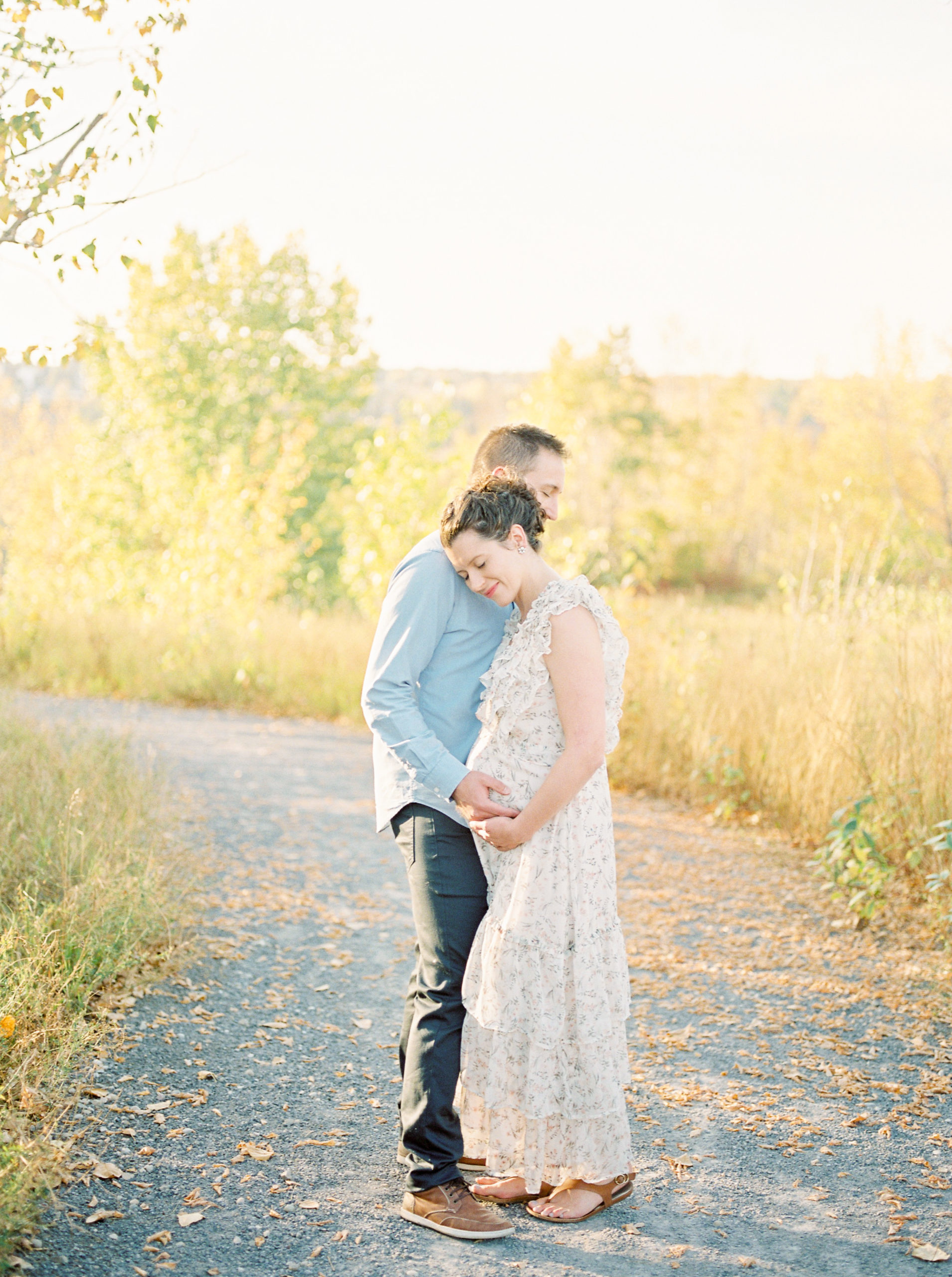 Edmonton Maternity Photographer capturing expectant parents in fall colours