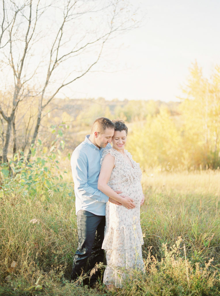 Edmonton Maternity Photographer capturing mom and dad in fall colours
