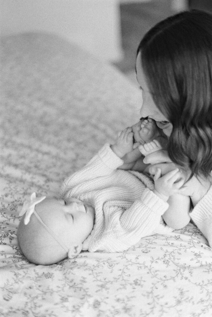 Newborn Photography in Edmonton, black and white image of baby with mom
