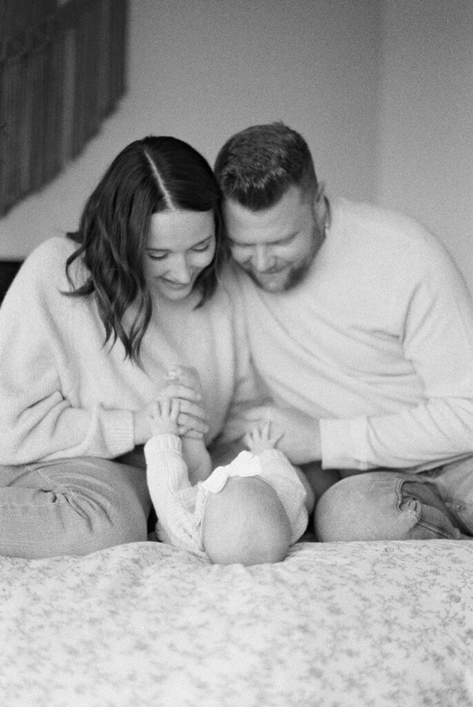 Newborn Photography in Edmonton, black and white image of baby with mom and dad
