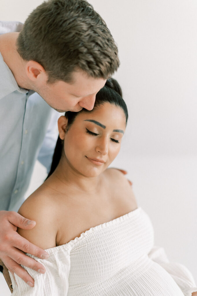 Edmonton photographer for beautiful maternity photos captures expectant mom and dad in studio