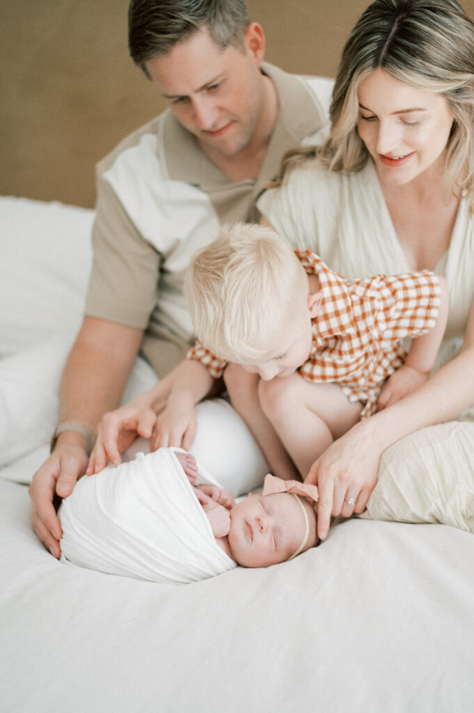Family with newborn and siblings.